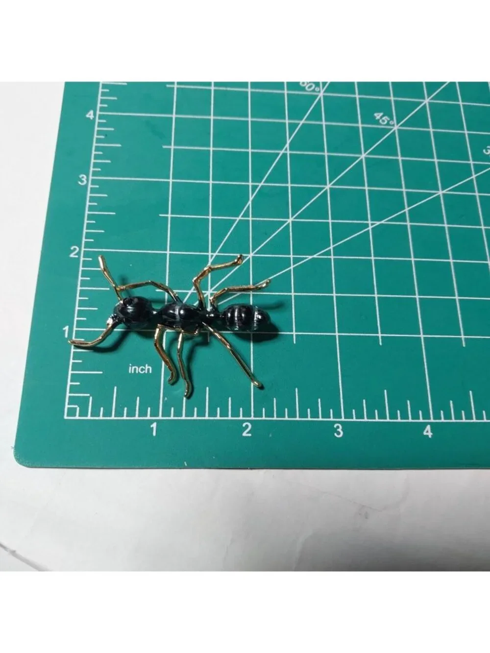 Ant Brooch With Black And gold detail